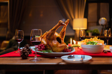 Christmas party food. A celebration dinner with a turkey, wine, champagne on Merry Christmas Eve Xmas on holiday at home. People lifestyle. Thanksgiving day