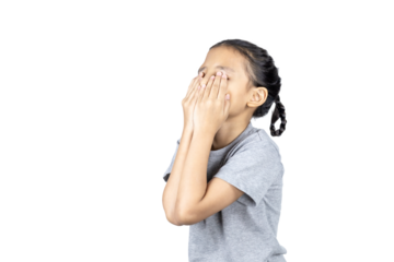 Asian little girl covers her face with her hand with clipping path.