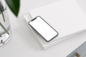 Blank smartphone mockup on the book