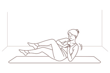 Sporty woman training on mat