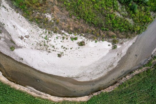 Aerial view of a dried out river bed during summer heat wave