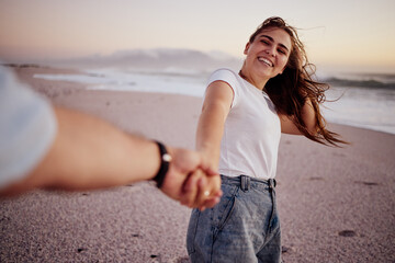 Pov, couple and holding hands on beach, sand and happy together, relax and smile on holiday,...