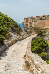 Fototapeta premium The city of Bonifacio perched on its scenographic cliffs on a sunny summer day. Southern Corse, France.