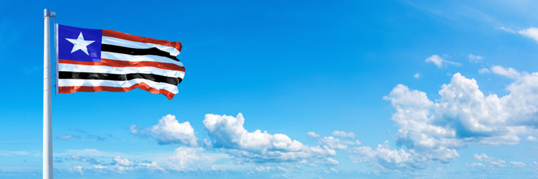 Maranh&atilde;o - state of Brazil, flag waving on a blue sky in beautiful clouds - Horizontal banner