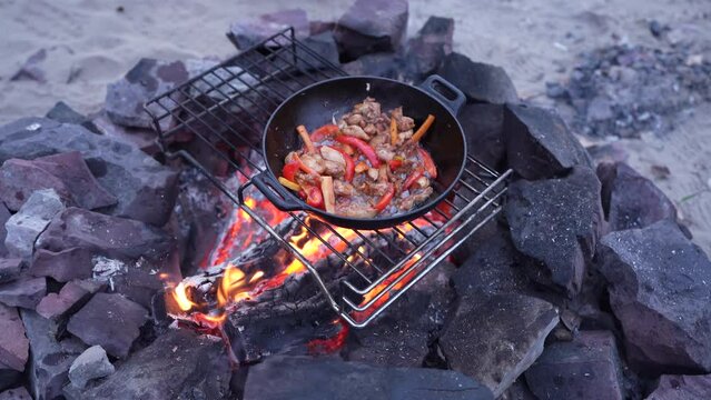 Frying Chicken In A Cauldron. Pieces Of Meat In A Cast-iron Frying Pan With A Round Bottom