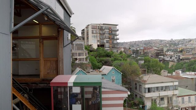 El Peral Funicular descending with tourists Cerro Alegre, Valparaiso. Upper station view. Chile