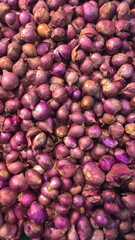 Shallots, also known as Asia red onion, displayed in the market