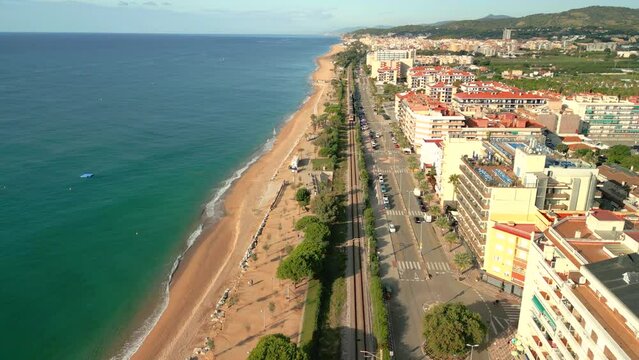 Images about the train of Rodalies beach and buildings Calella Pineda de Mar Santa Susanna Costa del Maresme aerial images of the beach