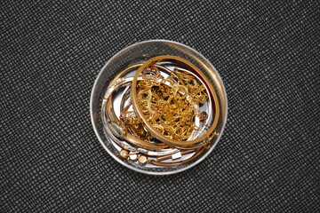 gold jewelry on a light background, Mixed gold and silver jewelry. treasure chest, All Mix Indian Traditional Gold Jewellery Isolated On Black Background