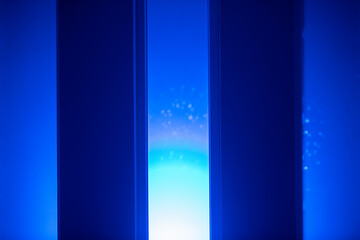 Neon Background. Window with blue backlight at the night club, bar, or studio room. Fluorescent laser light. 