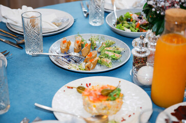 Banquet in the restaurant, serving tables, appetizers, sets