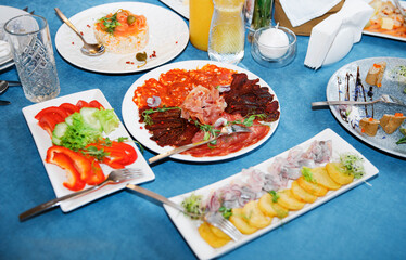 Banquet in the restaurant, serving tables, appetizers, sets