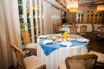 Banquet in the restaurant, serving tables, appetizers, sets