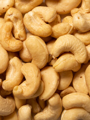 Cashew nuts as a background, top view. Cashew isolated on white background. Healthy foods.