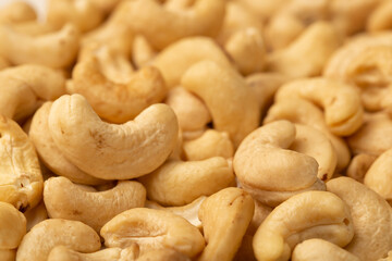 Cashew nuts as a background, top view. Cashew isolated on white background. Healthy foods.