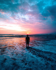 Man standing in front of an amazing sunset