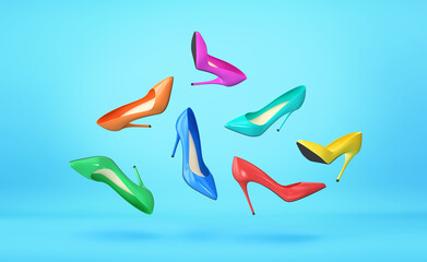 High heels in different colors flying over blue background