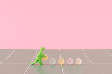 Creative arrangement made of dinosaurs and candies on a green and pink background. Minimal sweets...
