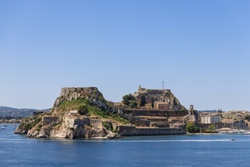Fototapeta na wymiar The Old Fortress stands on the eastern side of the town, on a rocky peninsula that gets into the Mediterranean sea, Corfu island, Greece