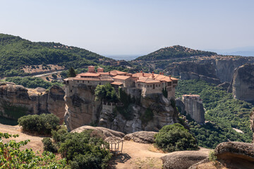 Fototapeta na wymiar Varlaam monastery in the foreground to the Rousanou Monastery in the background below,  Kalabaka municipality, Trikala, Thessaly, Greece.
