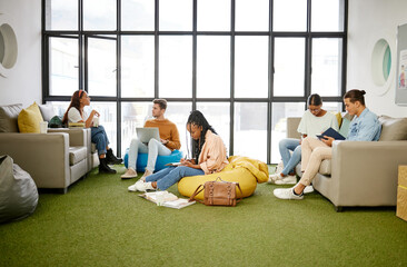 Students, diversity and relax study space in school, college or university campus for research...