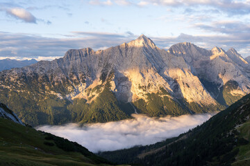 Mountain Hochwand in the Gaistal valley above the clounds in the morning. Beautiful hiking in Austria, Tyrol
