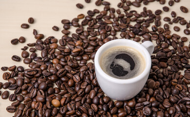 One cup of coffee with crema, Roasted espresso beans on dark background, close-up still life hot beverage, I love coffee concept