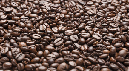 Dark roasted espresso coffee beans background