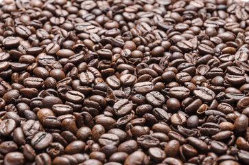 Dark roasted espresso coffee beans background
