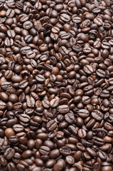 Dark roasted espresso coffee beans background