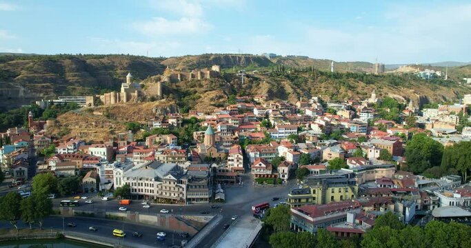 Aerial view of the old city center of Tbilisi and the Narikala fortress. Drone view of Tbilisi, the capital of Georgia. Summer sunny day