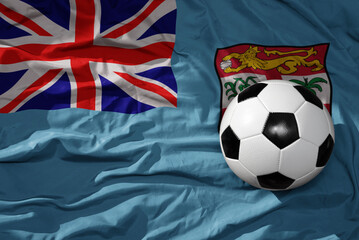 vintage football ball on the waveing national flag of Fiji background. 3D illustration