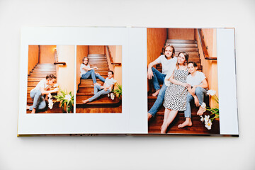 pages of a photobook from a photo shoot of a large family. 