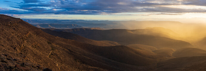 Dramatic sunset view from the edge of the Roggeberg Escarpment into the Tankwa Basin near...