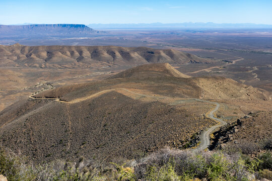 View of Ouberg Pass down the Roggeveld Escarpment looking into the Tankwa Basin with the Cederberg Mountains in the distance. Near Sutherland. Northern Cape. South Africa.