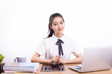 Asian female students taking an online class against a white background