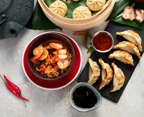 Assorted Chinese food on dark background. Asian food concept. Top view.