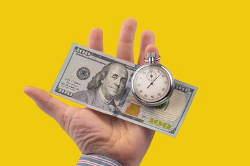 mechanical stopwatch and dollars in man hand. Part time accuracy for business. business and finance...