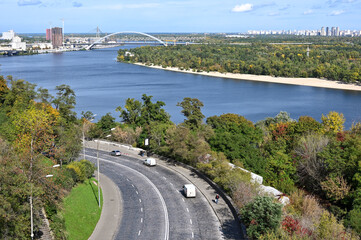 Top view of the highway and the bridge across the Dnieper river in the city of Kyiv 