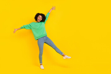 Full size portrait of overjoyed cheerful girl enjoy free time freedom isolated on yellow color...