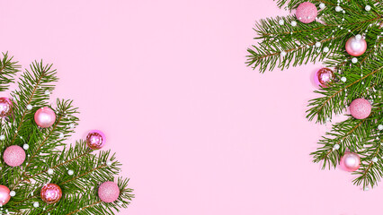Naklejka na ściany i meble Beautiful Chrismtas background with pastel pink ornaments on fir branches on pastel pink theme. FLat lay