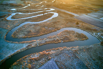 Meanders of river over frozen plains. 