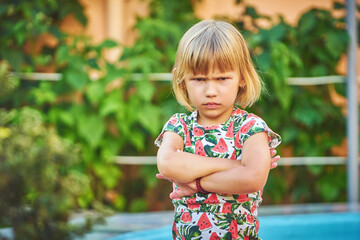 Angry little girl outdoors