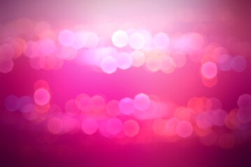 Shades of pink shiny bokeh blur background for holiday decor.