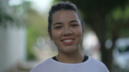 Portrait of a smiling casual young woman. A hispanic South American 20s girl closeup face