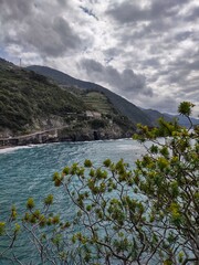 Seacoast of Cinque Terre with its villages and nature in Italy during a gloomy day of spring