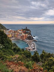 Naklejka premium Seacoast of Cinque Terre with its villages and nature in Italy during a gloomy day of spring