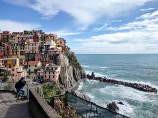 Fototapeta na wymiar Seacoast of Cinque Terre with its villages and nature in Italy during a gloomy day of spring