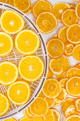 on a white background, sliced fresh and dried orange, close-up