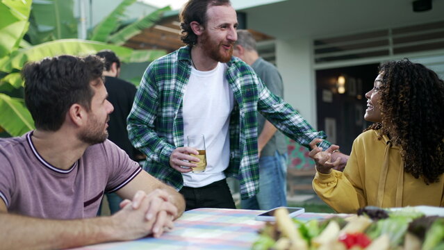 Friends Conversing Outdoors In Home Backyard Barbecue. Diverse Group Of People Talking At Party 2